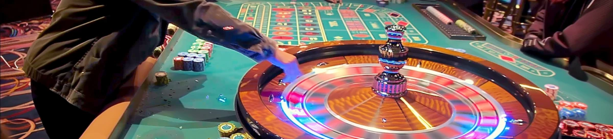 Roulette wheel and a dealer in action